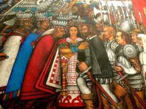 Mural by Desiderio Hernández Xochitiotzin showing Moctezuma, Cortez and Malintzin located in Tlaxcala City, Mexico.