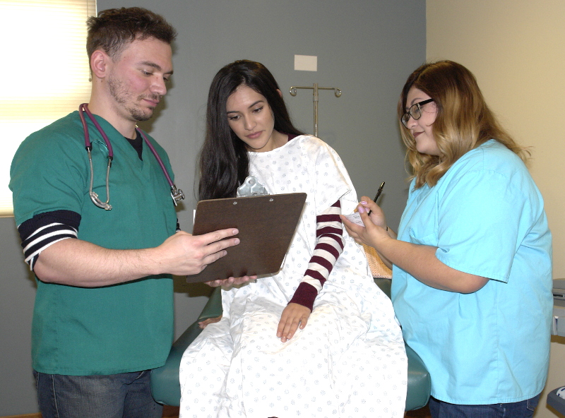 Medical interpreter working with a provider and a patient